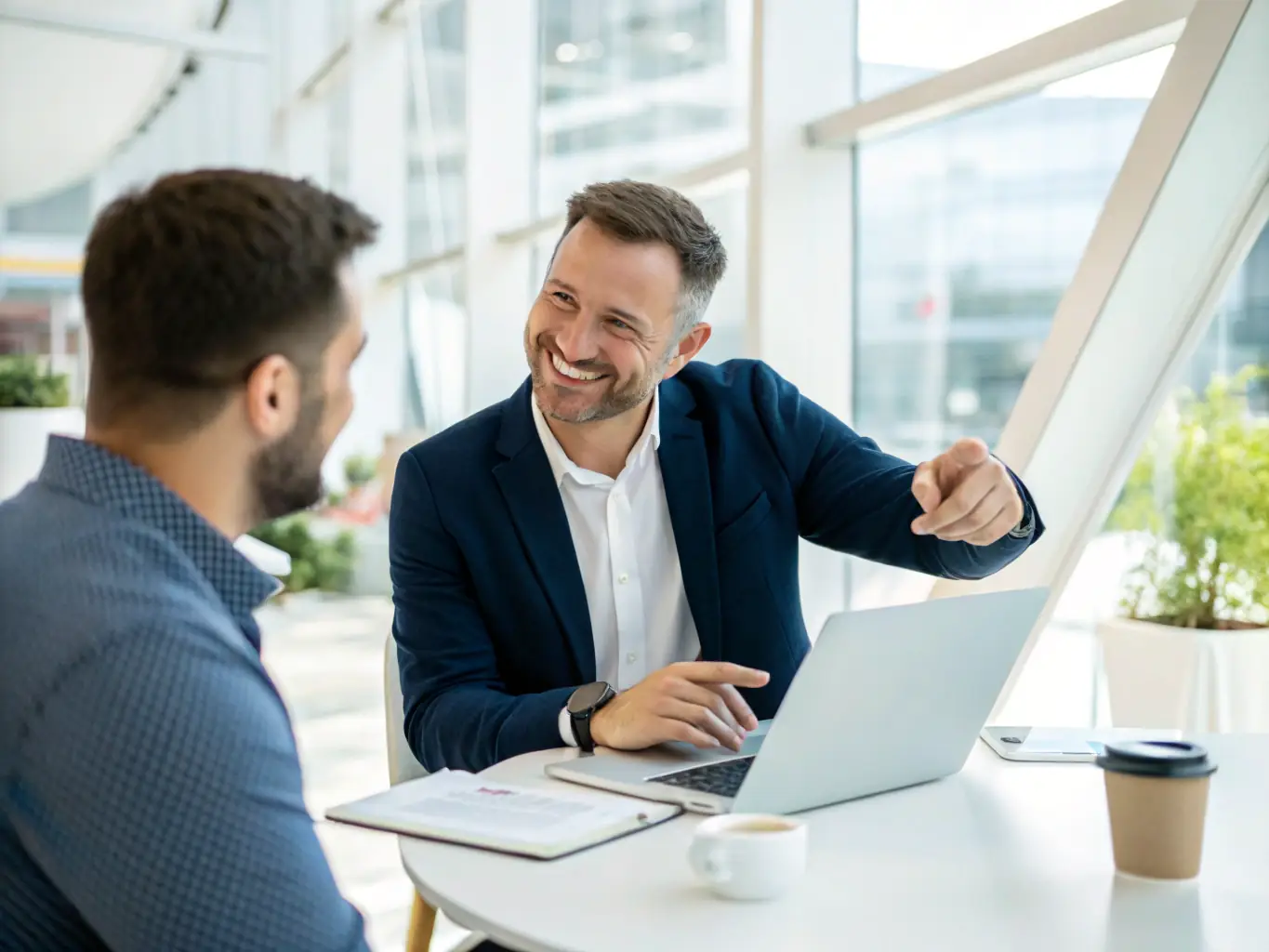 An image of a consultant assisting a client with technology implementation in a modern office setting, showcasing the collaborative and hands-on approach of AstroSpark's services.